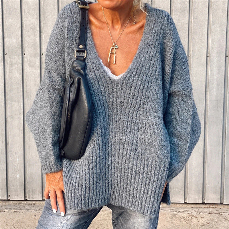 V-neck knitted sweater with side slits